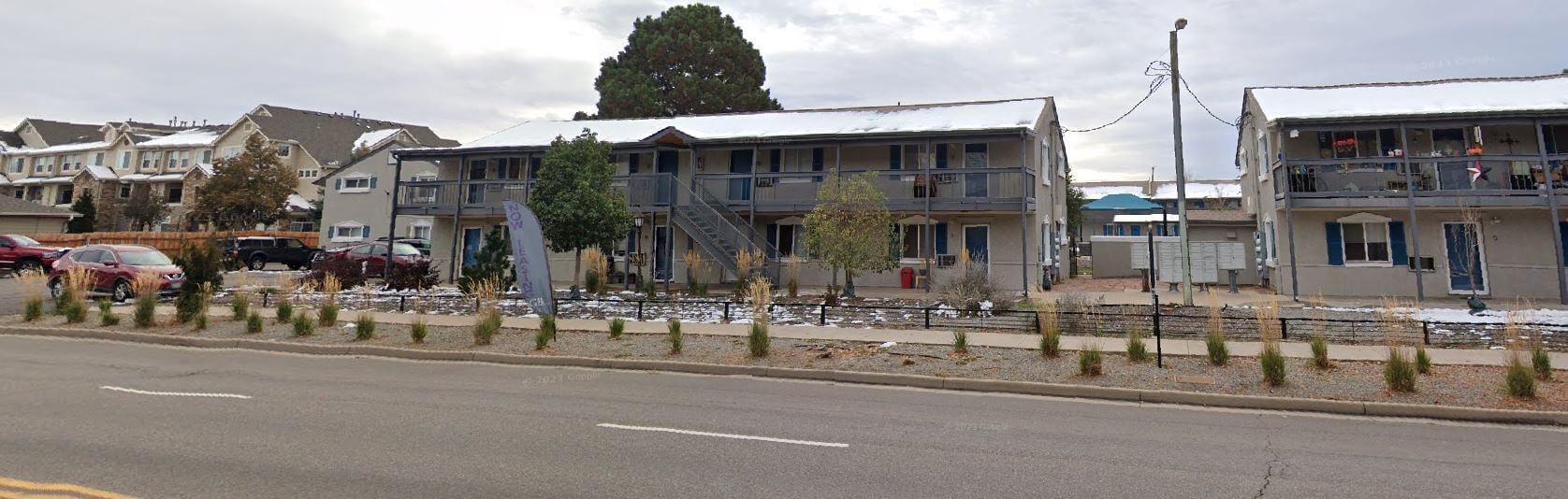 Google Maps Street View image of Cherry Creek Square Apartments, showing the front facade and surrounding street area.